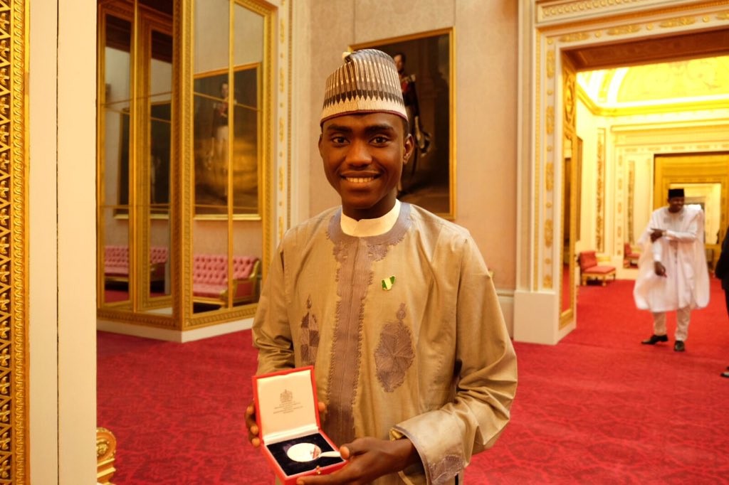 Imrana with his Medal at the Buckingham palace